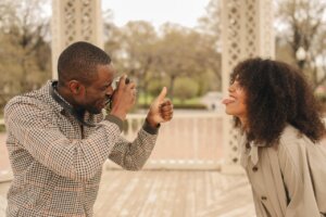 close-up-photo-of-man-taking-photo-of-a-woman